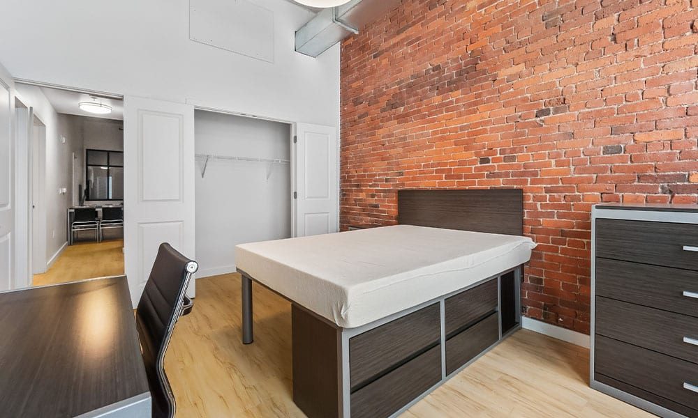 Bedroom area in an apartment at Union on 5th