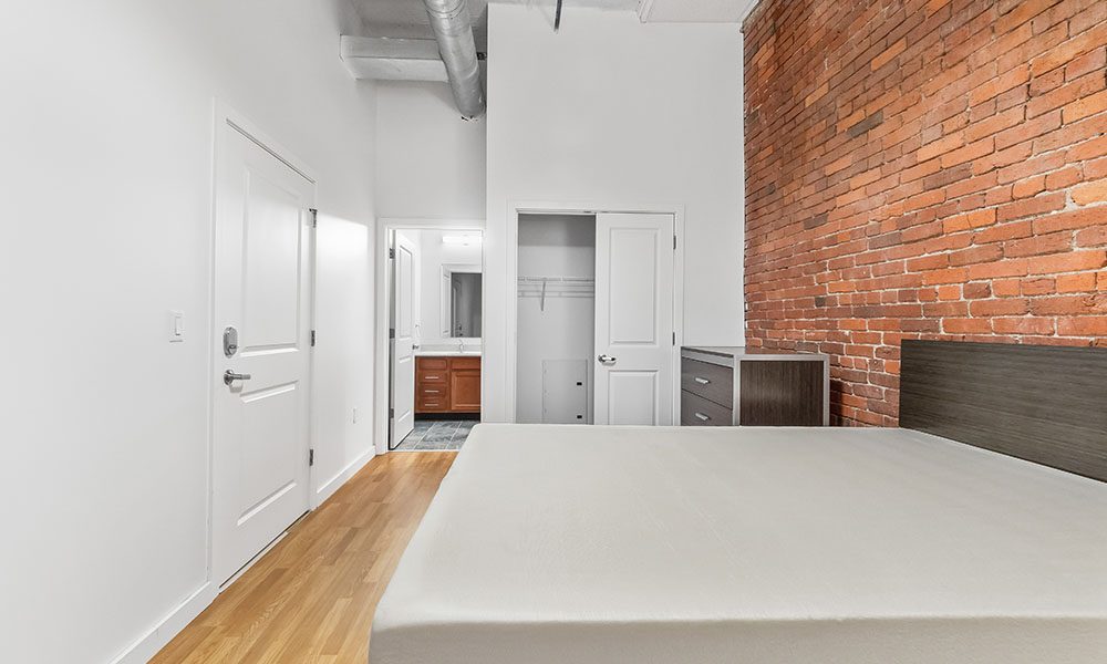 Bedroom area in an apartment at Union on 5th